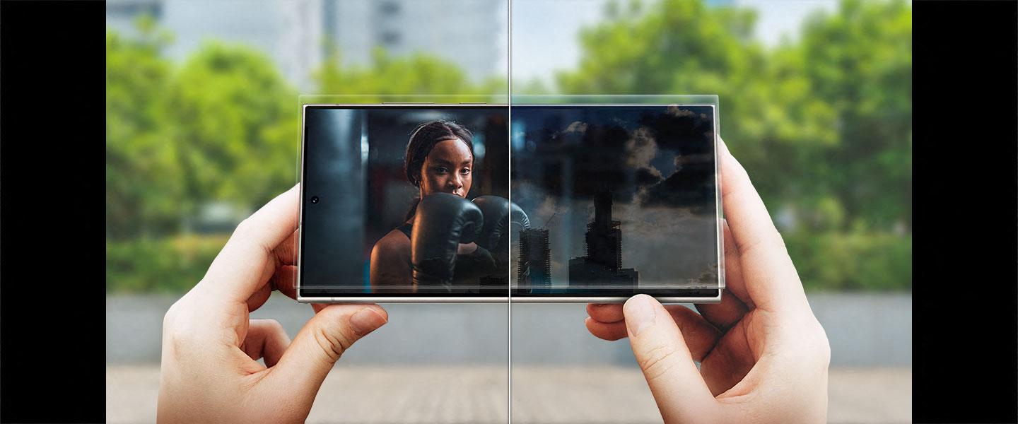 Ein Video mit klar zu erkennenden Inhalten wird in einem Vorher-Nachher-Vergleich auf dem Display eines Galaxy S24 Ultra angezeigt. Das Smartphone ist drauen bei Tageslicht zu sehen und auf dem Display wird ein Video abgespielt.