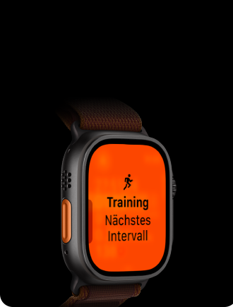 Apple Watch Ultra 4, Titangehäuse, Farbe Schwarz, Lauftraining, nächstes Intervall, linke Seitenansicht, Actiontaste in Orange, Alpine Loop Armband