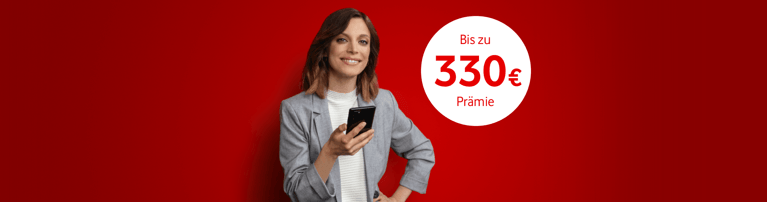 Person im grauen Blazer mit Smartphone vor rotem Hintergrund, daneben ein weißer Kreis mit "265 € Prämie" Text.
