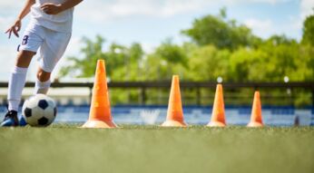 Young Footballer Enjoying Practice