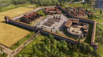 Im Screenshot aus Anno 117: Pax Romana ist eine römische Militäranlage zu sehen, umgeben von einer massiven Steinmauer mit Wachtürmen. Im Innenhof formieren sich Legionäre und Reiter in präziser Formation, flankiert von Katapulten. Rechts liegt ein befestigter Kommandoposten, links Werkstätten und Ställe.