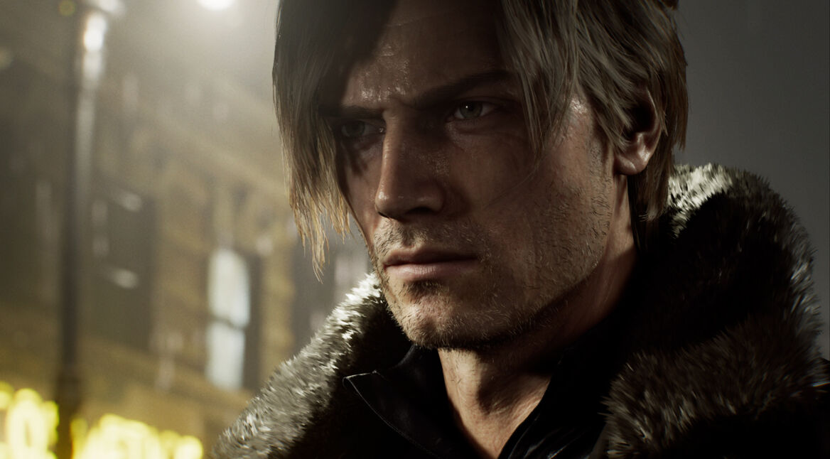 Auf dem Bild aus dem Resident Evil Requiem Test ist Leon S. Kennedy in einer intensiven Nahaufnahme zu sehen. Sein Gesicht wirkt angespannt und entschlossen, feine Narben und Bartstoppeln sind deutlich erkennbar. Er trägt eine dunkle Jacke mit Fellkragen. Das warme, gedämpfte Licht im Hintergrund verstärkt die düstere, ernste Atmosphäre der Szene.