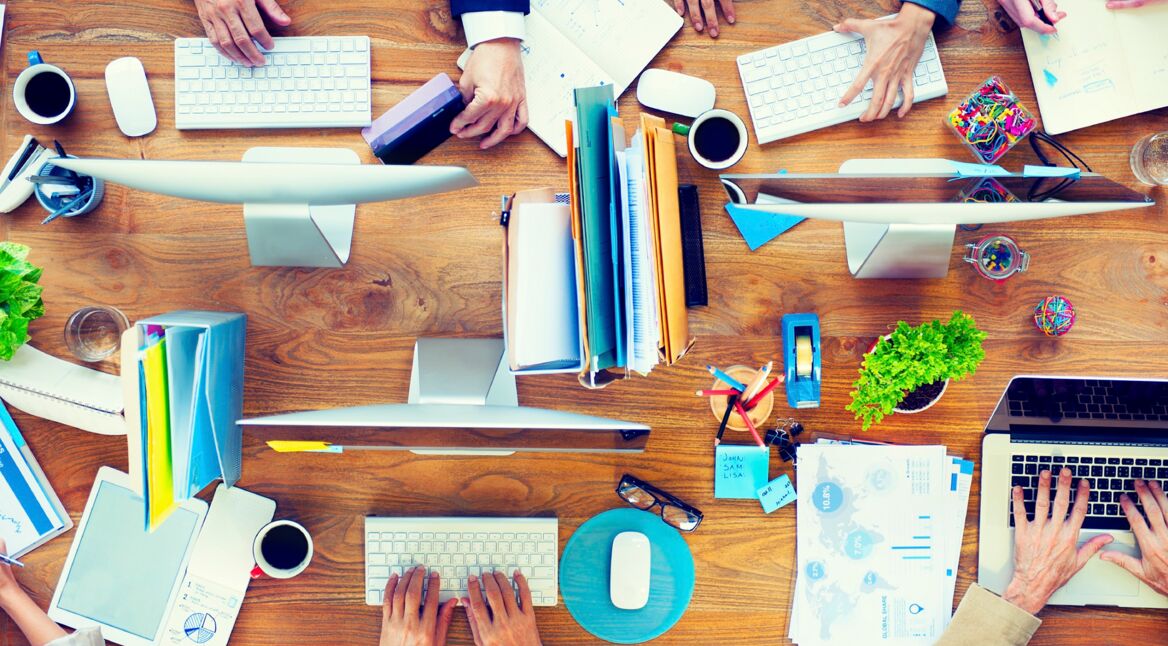 Group of Business People Working on an Office Desk