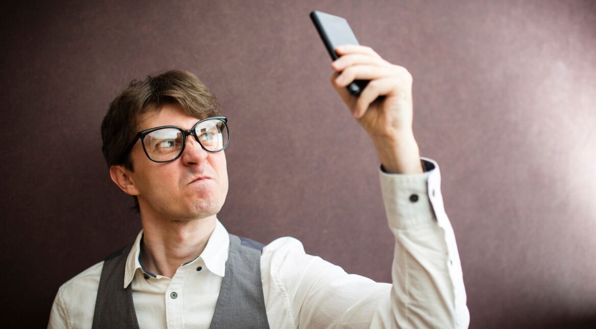 Angry man with mobile smartphone