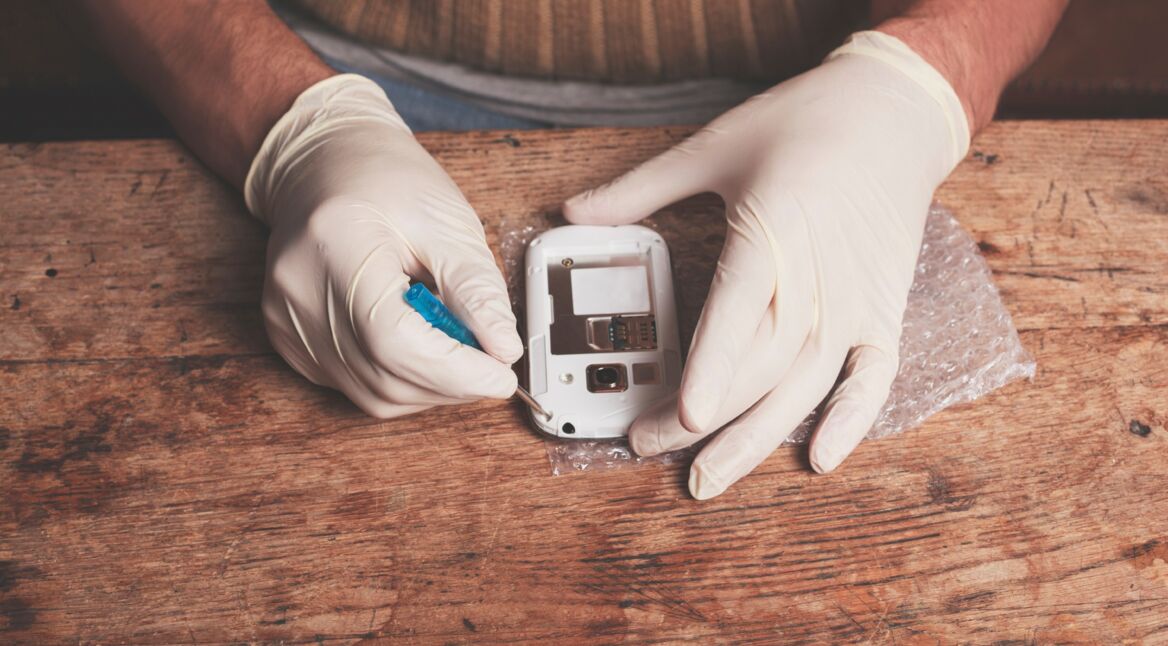 Technician fixing smart phone