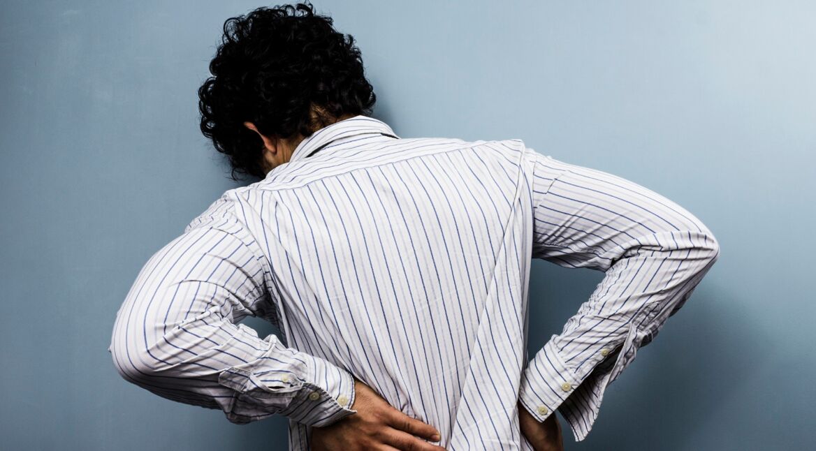 Young man with back pain