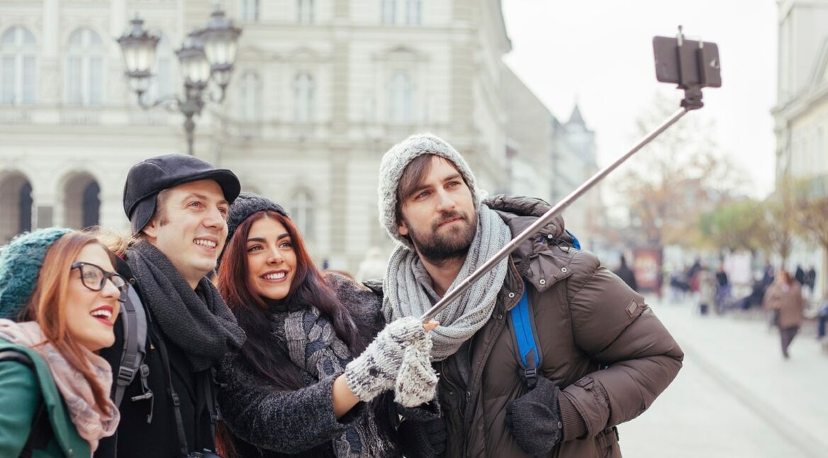 Group Of Tourists Taking Selfie