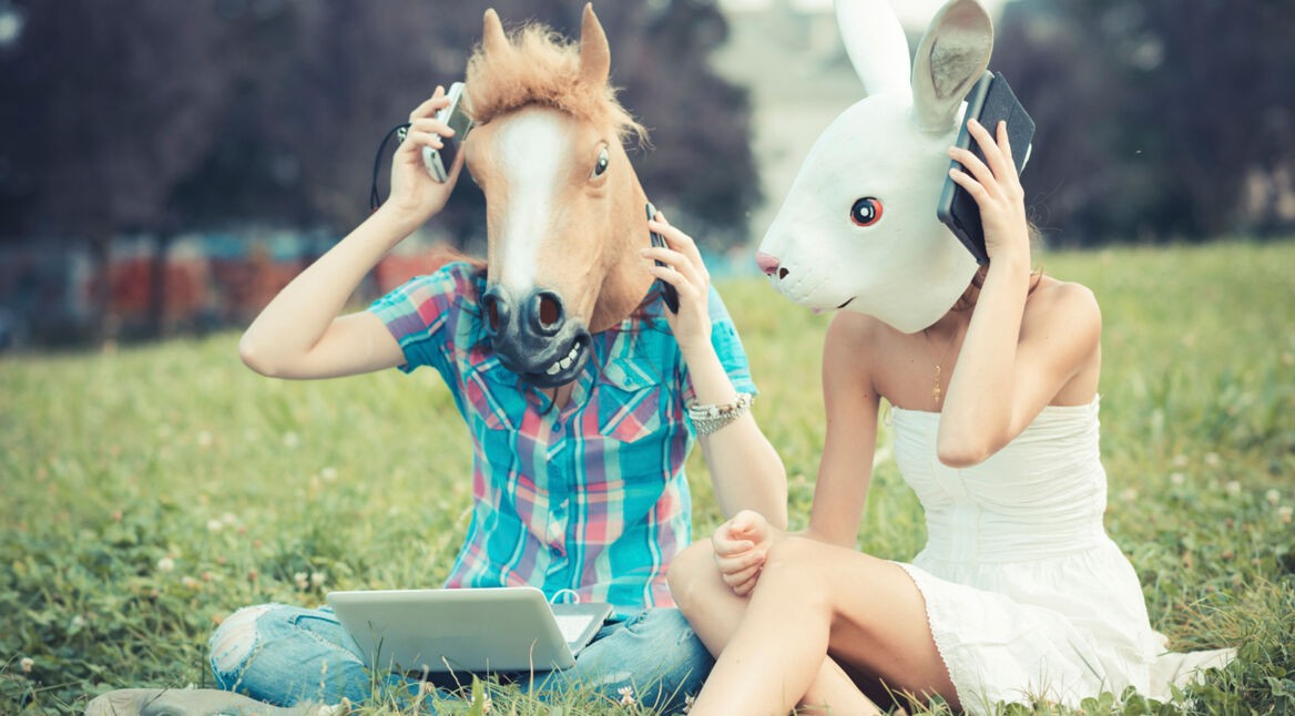 mask horse and rabbit women sisters friends using smartphone and