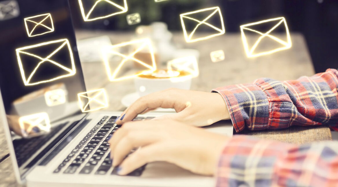 Email concept with laptop ang girl hands