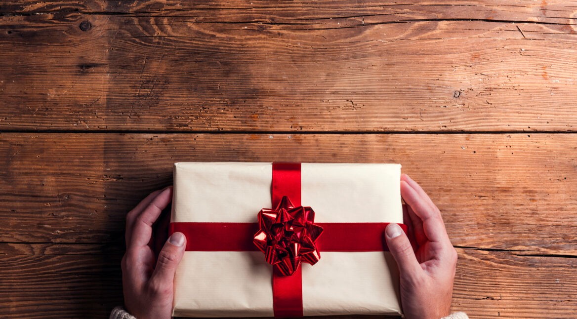 Man holding Christmas present