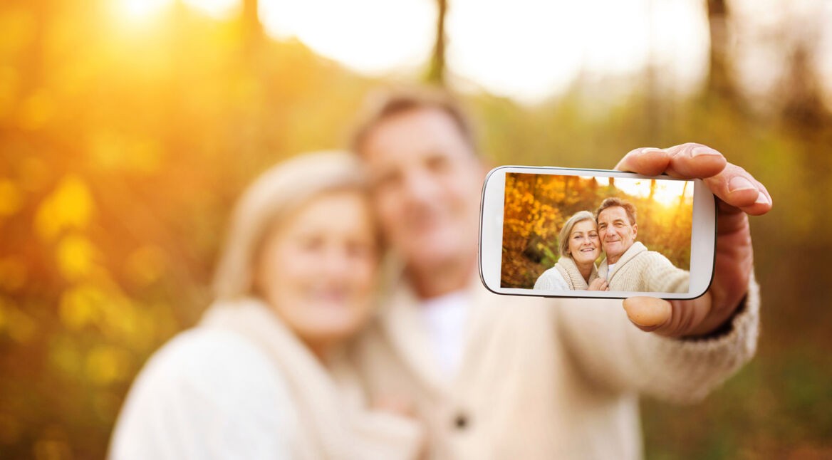 Active seniors taking selfies of themselves