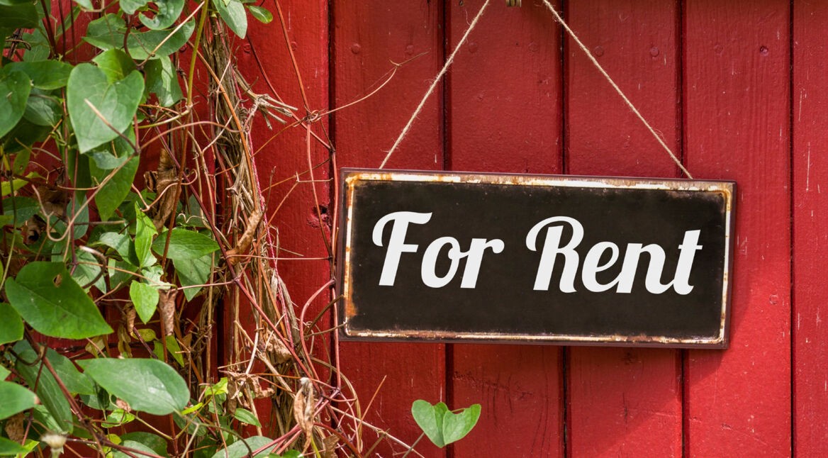 Old metal sign with the inscription For Rent
