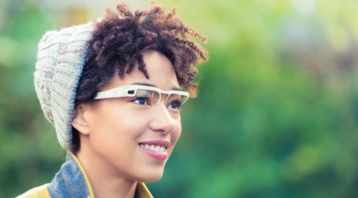 Woman with wearable computer in form of smart glasses.