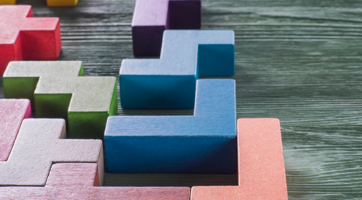 The concept of logical thinking. Wooden geometric shapes.