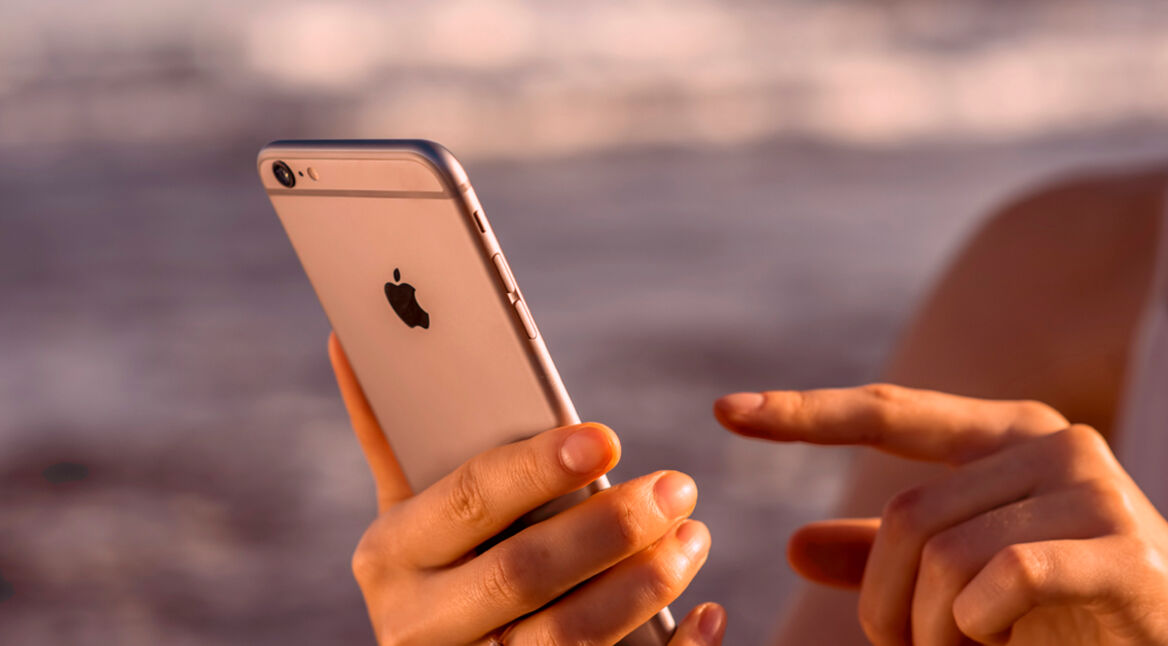Female hands holding new iPhone 6s Space Gray