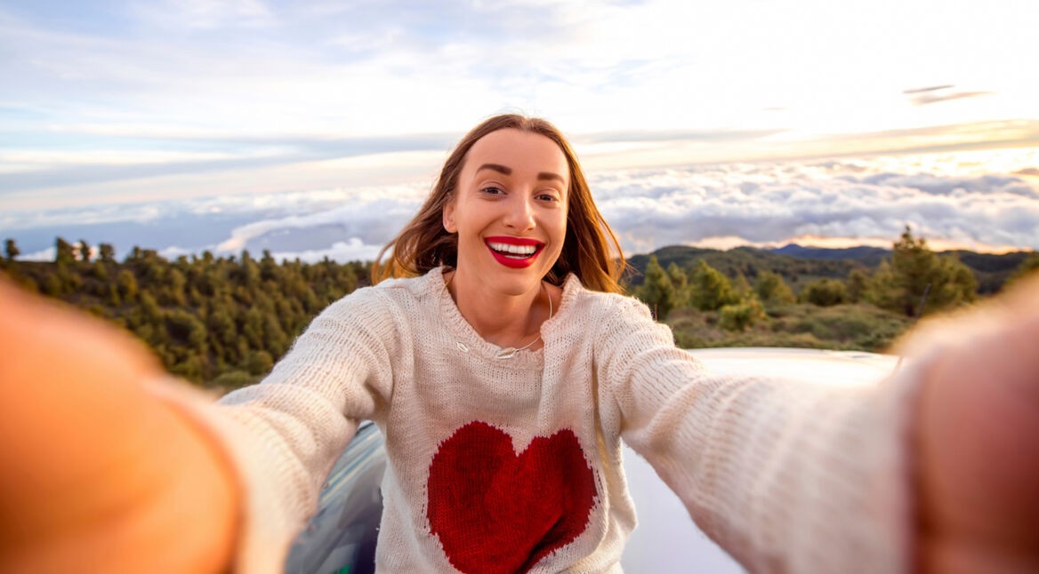 Woman making selfie outdoors