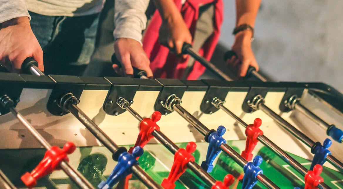 People playing foosball