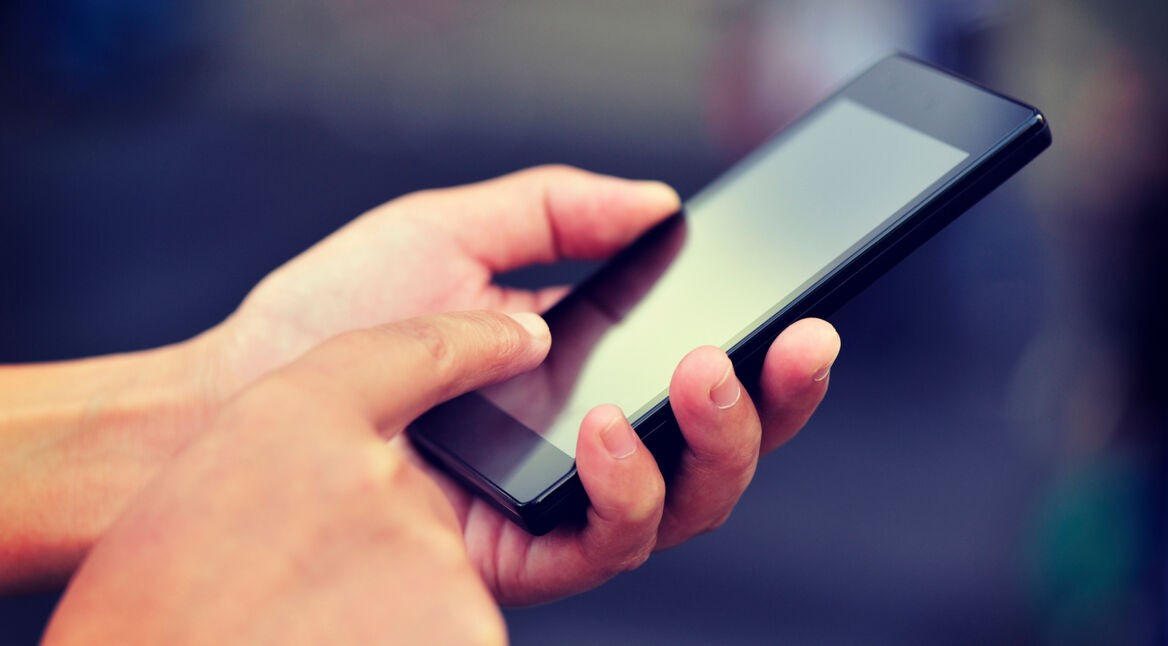 hands use smart phone at city