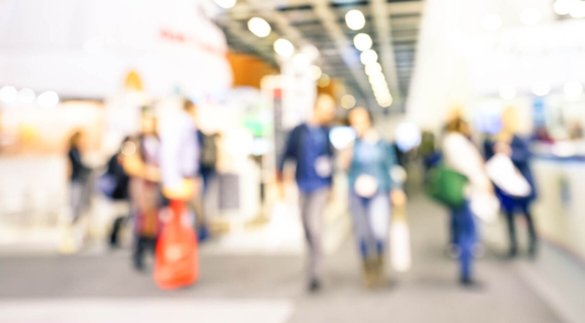 Defocused bokeh abstract of generic trade show expo stand booth