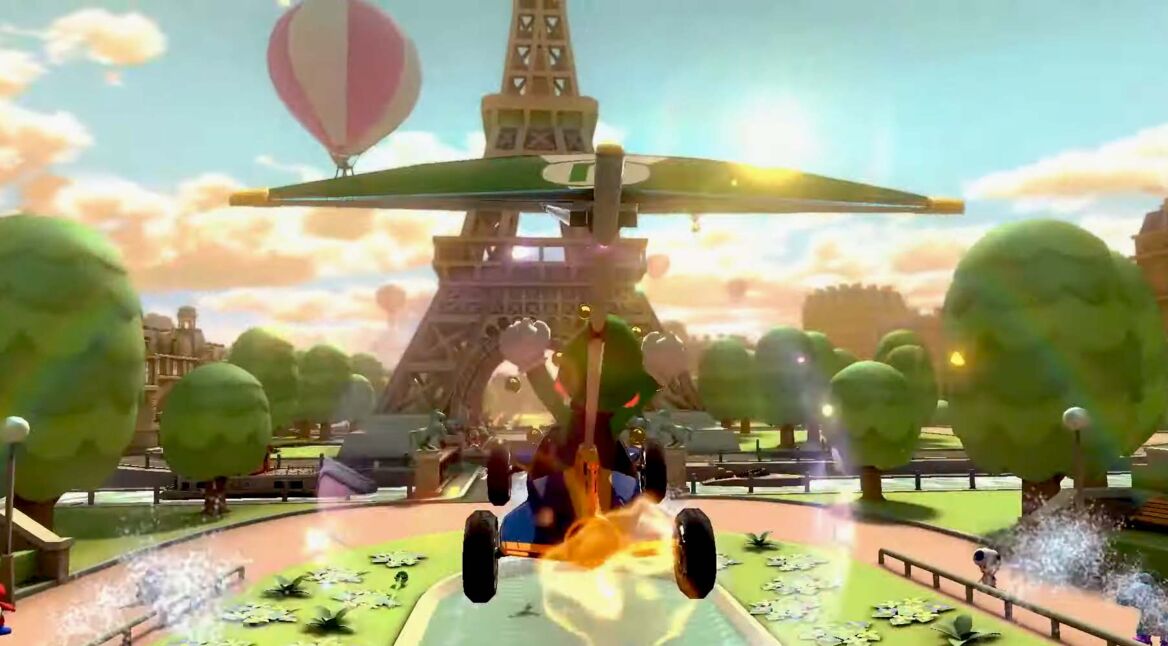 Luigi gleitet in Mario Kart 8 Deluxe von einen hohen Position auf die Rennstrecke