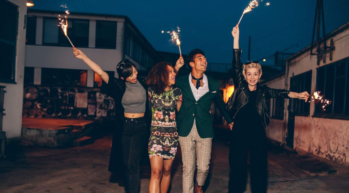 Friends enjoying night with sparklers