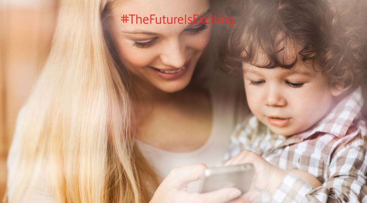 Mother and son looking at mobile phone