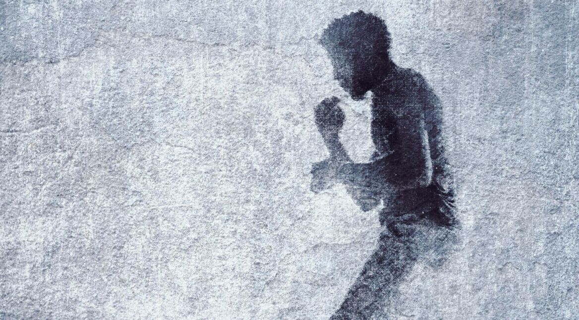 Boxer graffiti on old brick wall