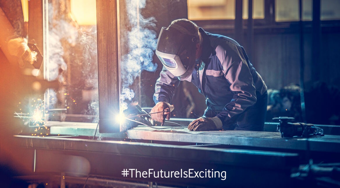 Industrial worker with welding tool