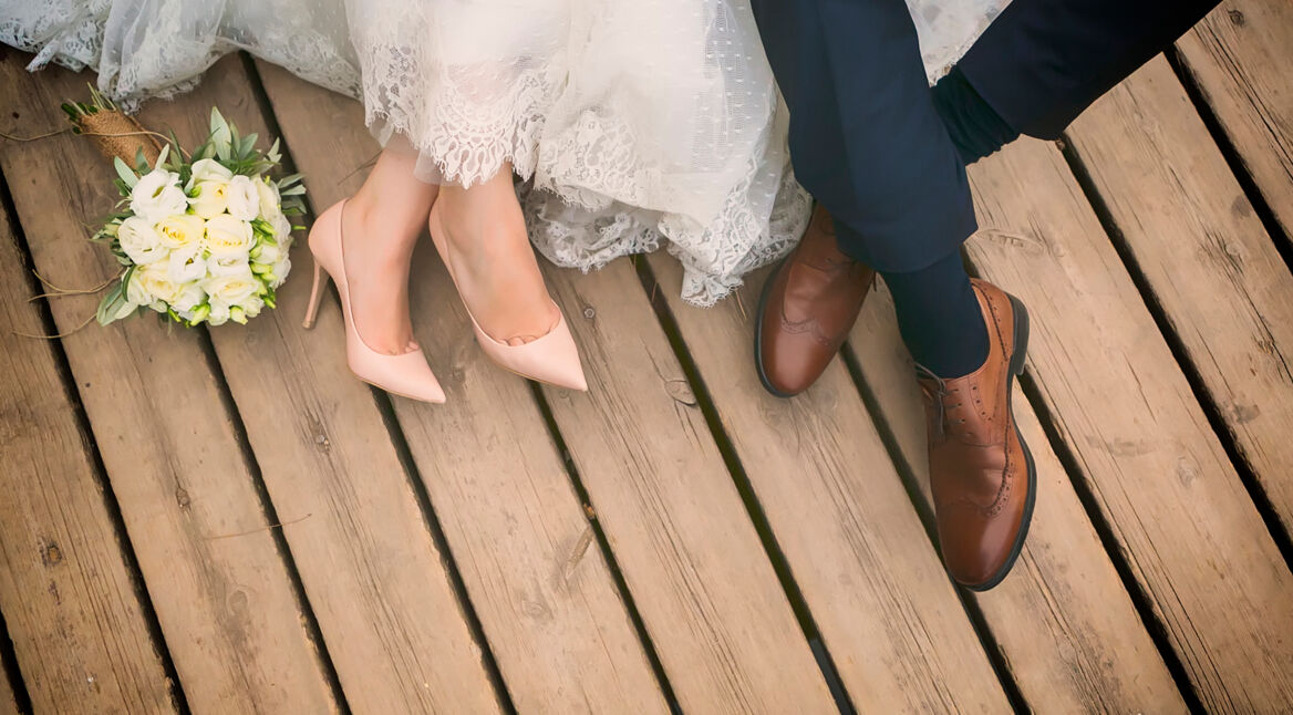 feet of bride and groom, wedding shoes (soft focus).