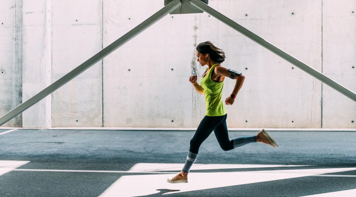 Sportswoman jogging outside