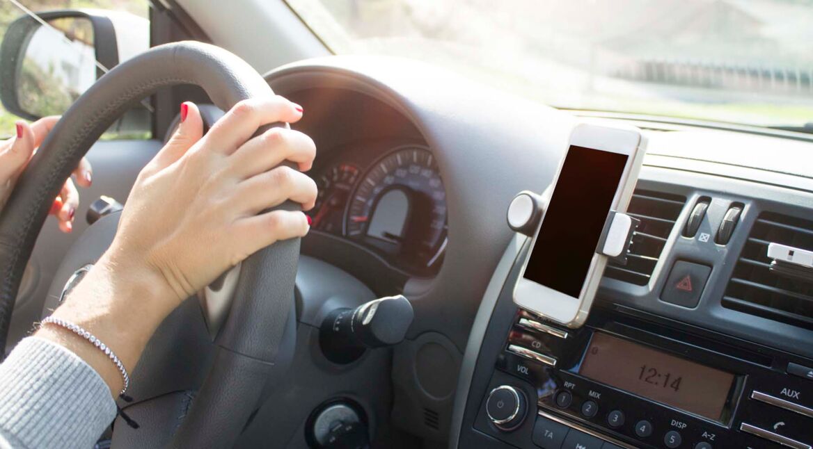 mobile phone with map gps navigation in car with hand