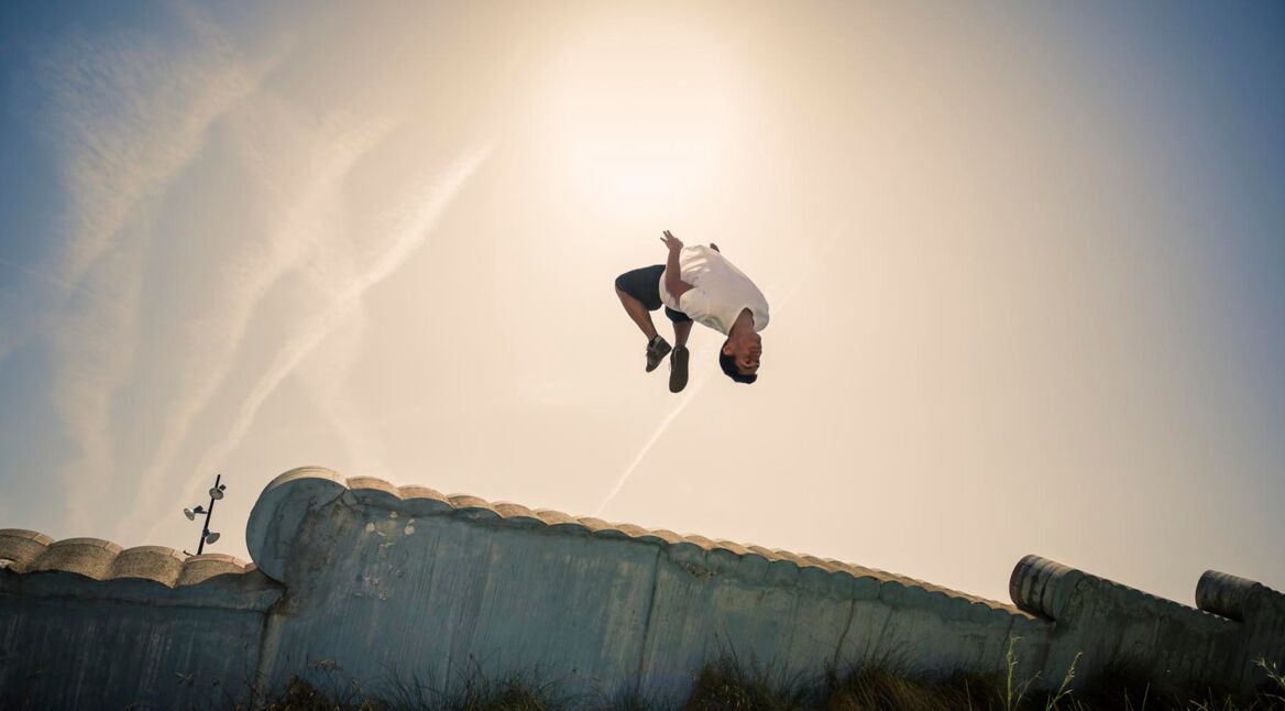 Parkour in the city man doing a backflip
