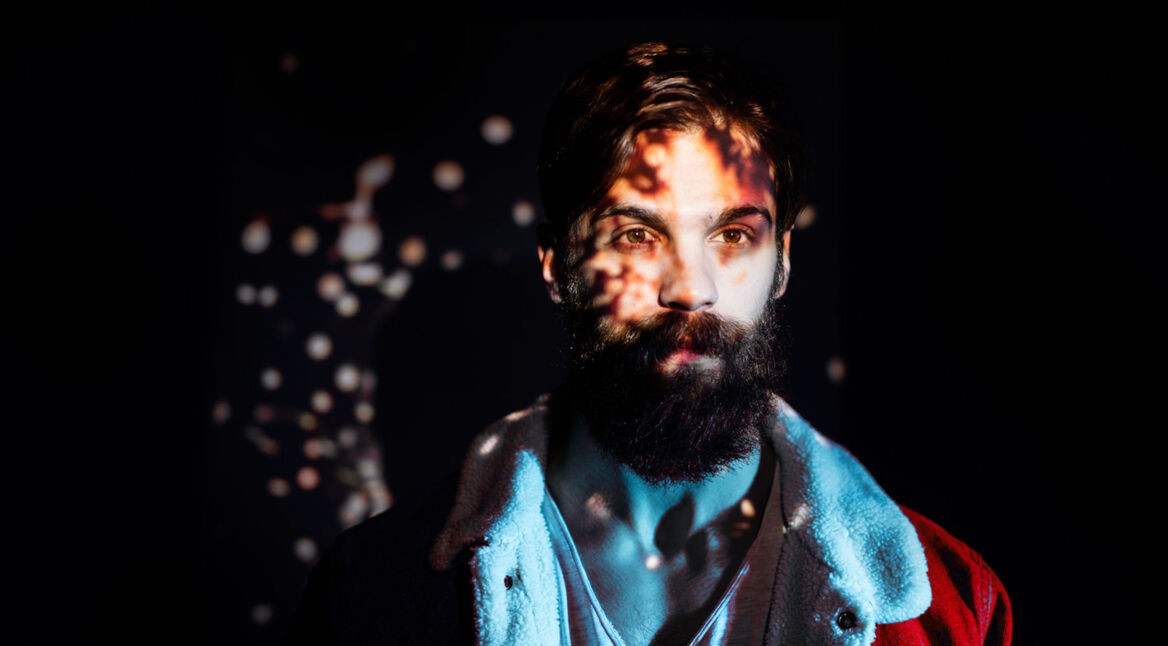 Firecracker spark image projected on a young man upper body