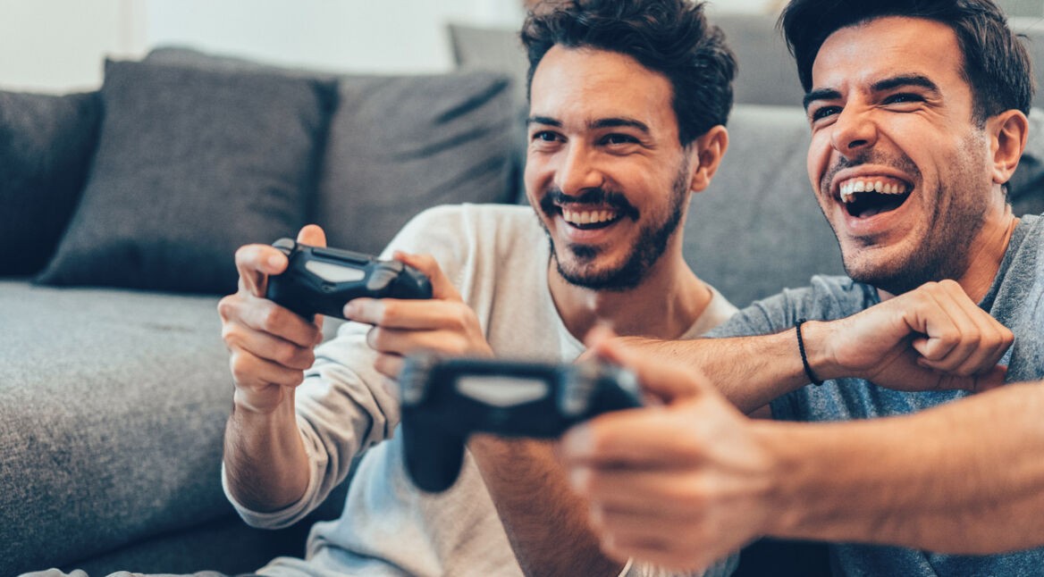 Two Young Men Playing Video Game