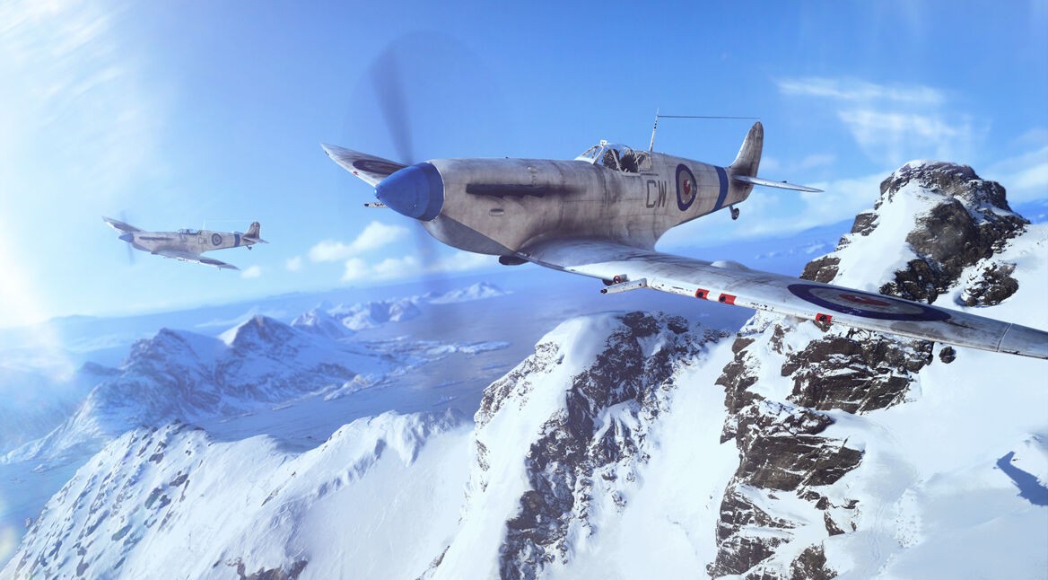 Zwei Kampfflugzeuge fliegen über eine Alpenlandschaft. Ein Screenshot aus dem Spiel "Battlefield V"