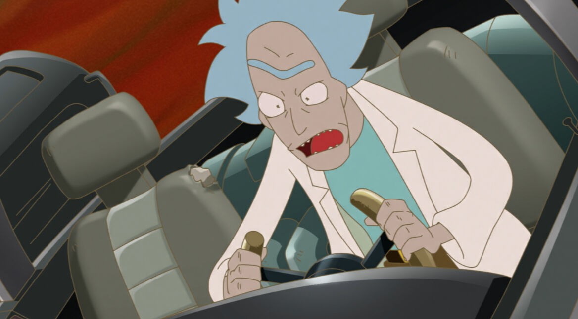 Auf dem Bild zu "Rick and Morty: The Anime" sitzt Rick hektisch am Steuer mit geöffnetem Mund.