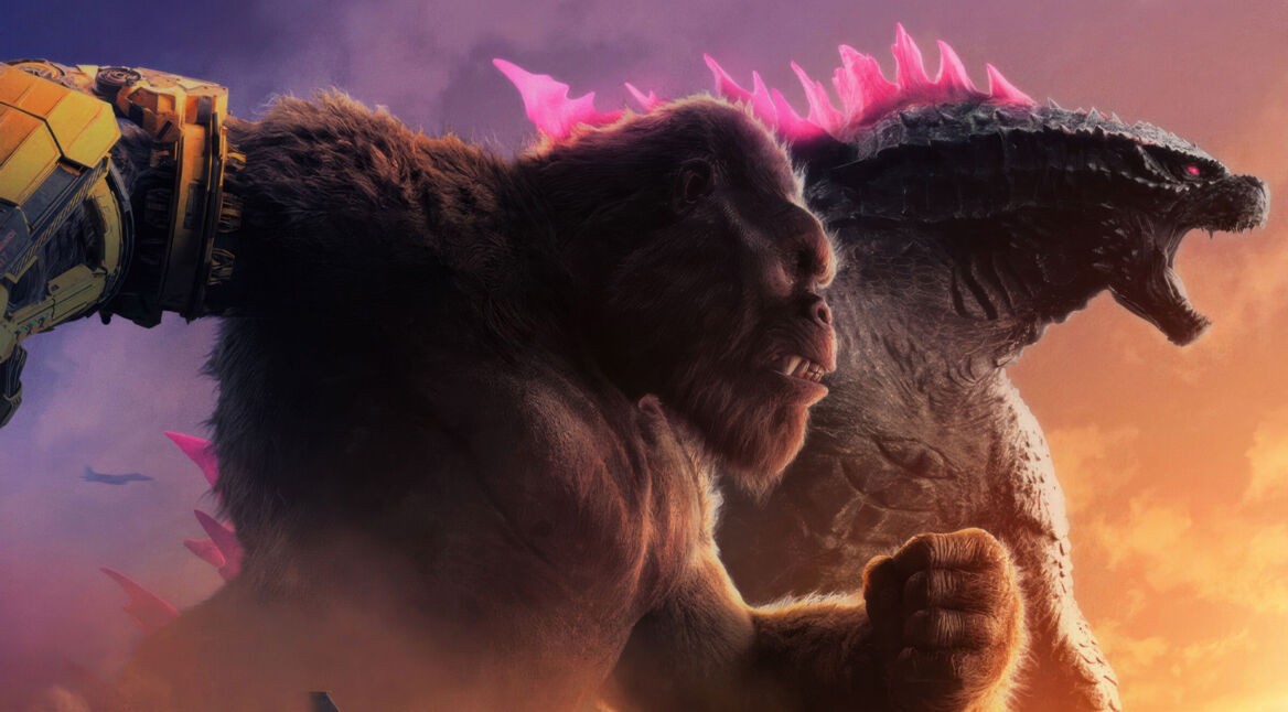 Auf dem Bild zu "Godzilla x Kong 3" stehen King Kong und Godzilla Seite an Seite in einer epischen Pose. King Kong, links, hat einen mechanischen Arm, während Godzilla, rechts, mit seinen leuchtenden, pinken Rückenstacheln brüllt. Der Himmel ist in dramatischen Farben von lila bis orange gehalten, was die bedrohliche und actiongeladene Stimmung unterstreicht. Im Hintergrund fliegen Jets, was auf eine bevorstehende Schlacht hinweist.