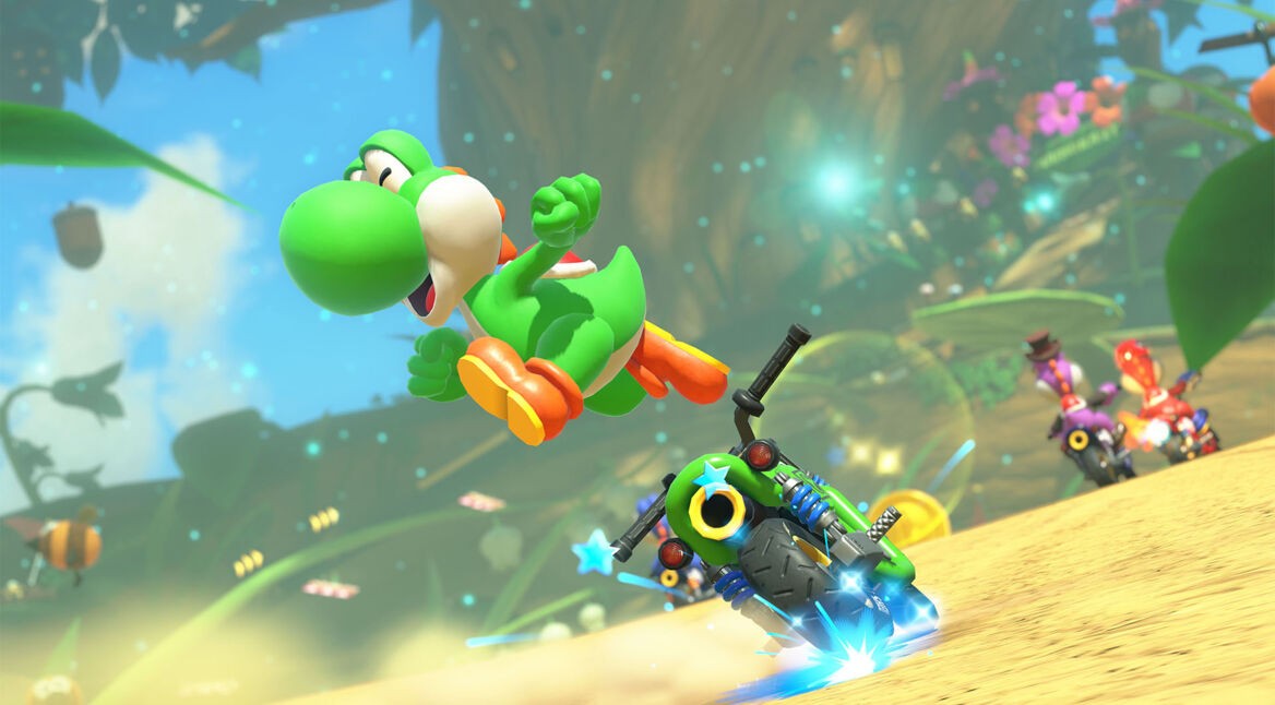 Screenshot von Joshi, der auf einem Motorrad durch die Welt von „Mario Kart World“ fährt.