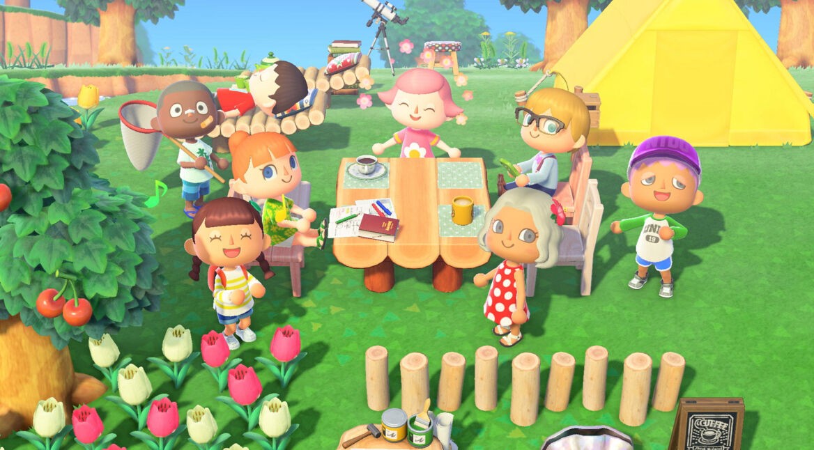 In dieser sommerlichen Szene aus Animal Crossing: New Horizons sitzen verschiedene Charaktere rund um einen Picknicktisch im Grünen. Einige unterhalten sich, andere entspannen in Liegestühlen oder halten ein Fangnetz in der Hand. Im Hintergrund steht ein gelbes Zelt. Die fröhliche Camp-Atmosphäre passt ideal zur Vorfreude auf Animal Crossing für die Switch 2.