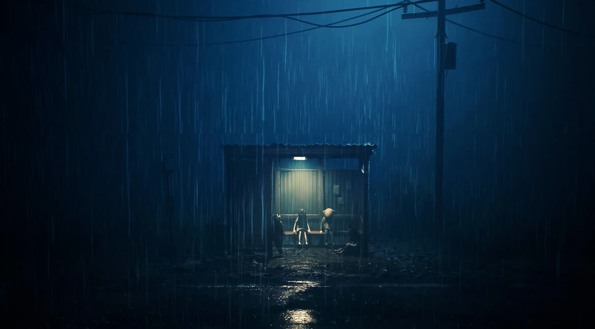 Drei Kinder stehen bei strömendem Regen unter einem spärlich beleuchteten Unterstand in „REANIMAL“.