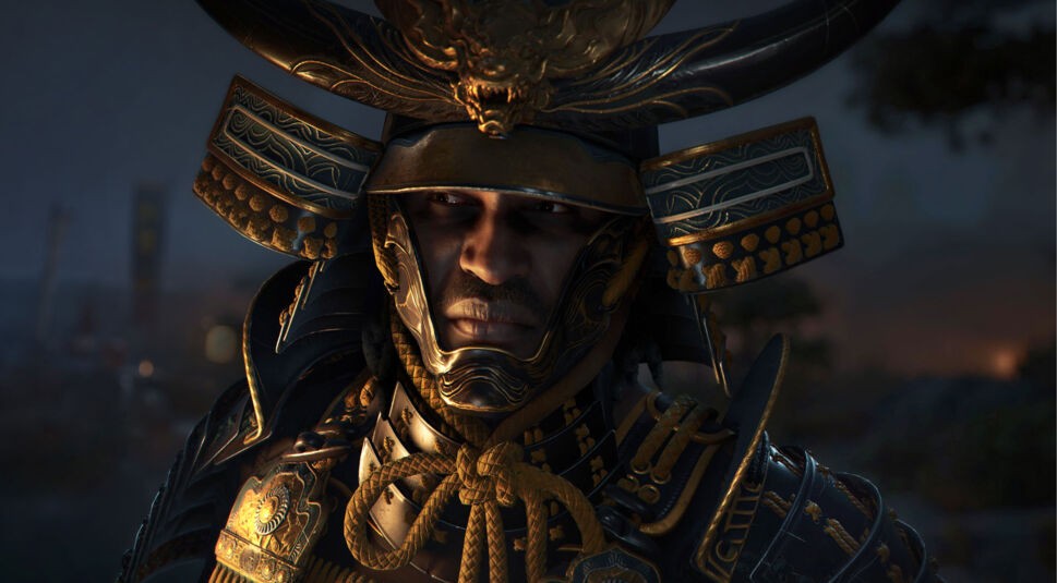 Auf dem Bild aus Assassin’s Creed Shadows ist Yasuke, ein legendärer Samurai, in eindrucksvoller Rüstung zu sehen. Sein Helm ist kunstvoll verziert mit goldenen Details und einem Drachenemblem, während sein Gesicht von Schatten und dramatischem Licht betont wird. Sein ernster Blick strahlt Entschlossenheit aus. Der dunkle, stimmungsvolle Hintergrund unterstreicht die epische Atmosphäre des Spiels.