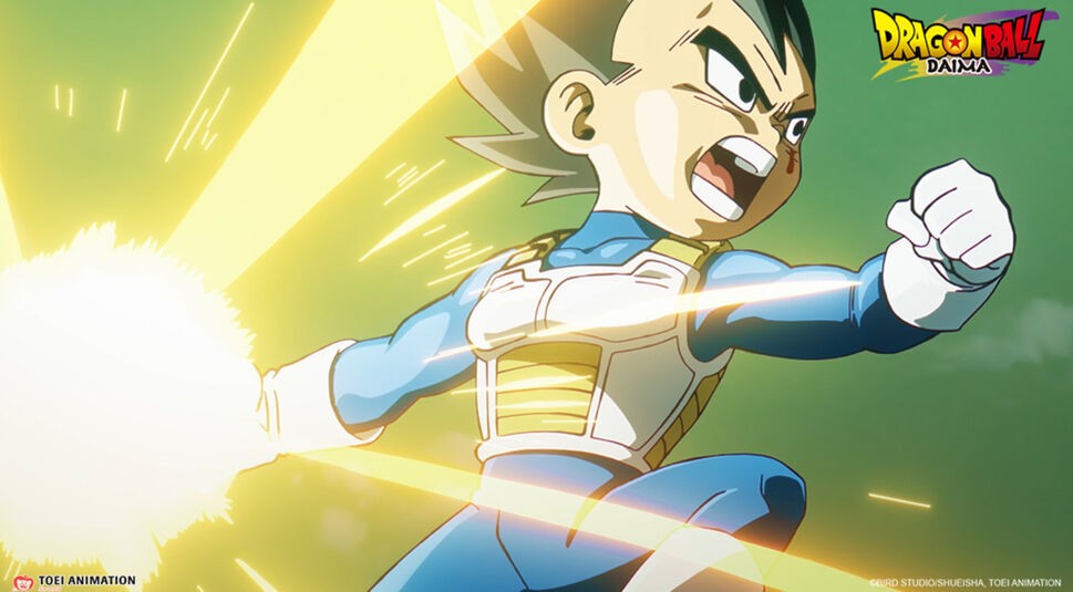 Auf dem Bild in dem Dragon Ball Daima-Artikel siehst Du einen Mini Vegeta in seiner typischen Saiyajin-Rüstung. Er schreit entschlossen und hält eine leuchtende Energieattacke in seiner Hand, während Lichtstrahlen von der Energie ausgehen.