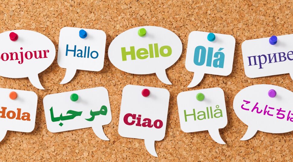 Hello in ten different languages on white speech bubbles