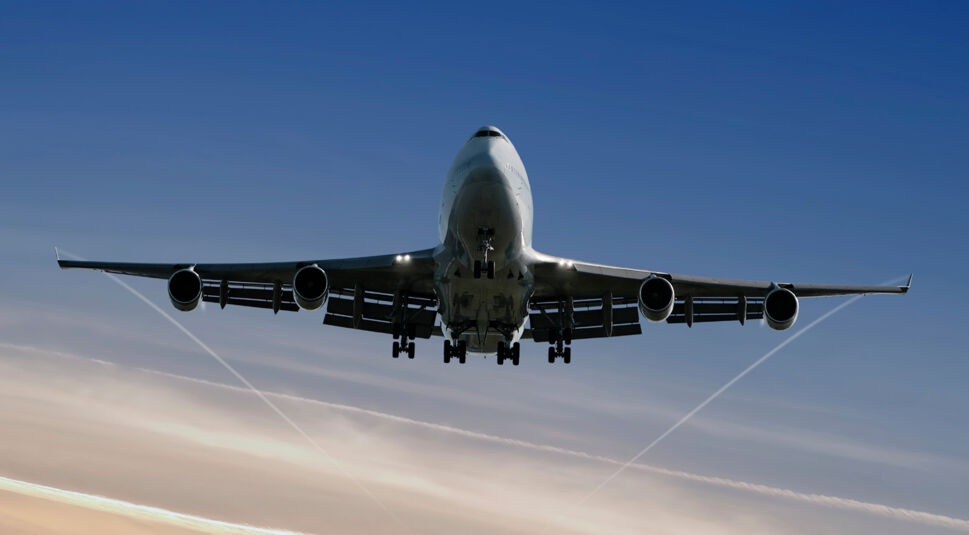 jumbo jet landing at dusk
