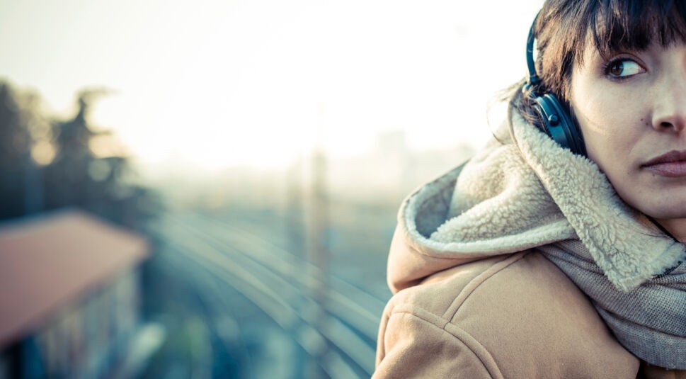 beautiful young woman listening to music headphones