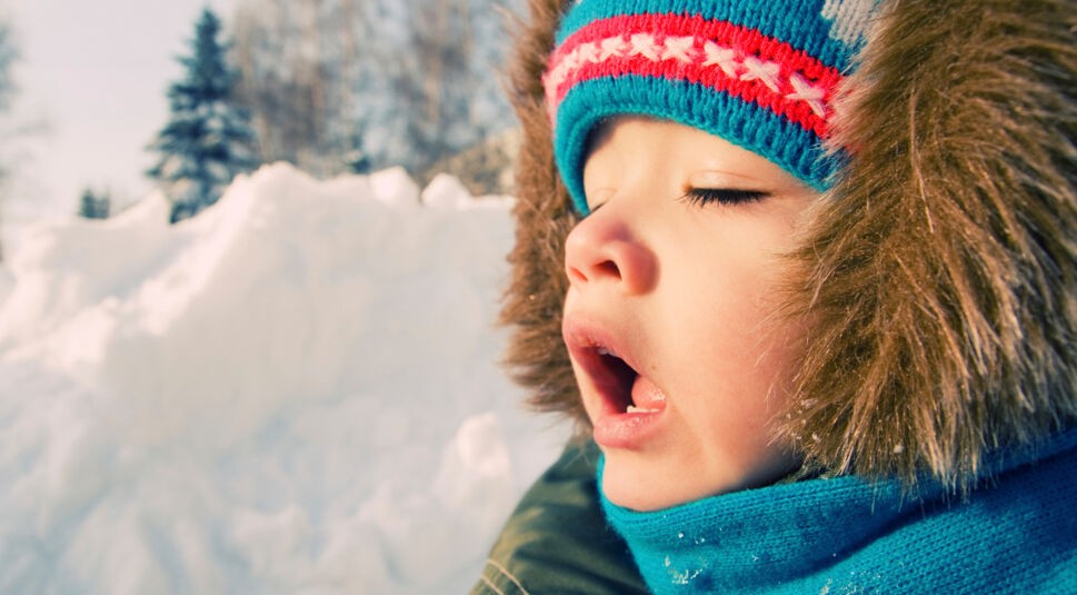 Kid want to sneeze. Snow winter.