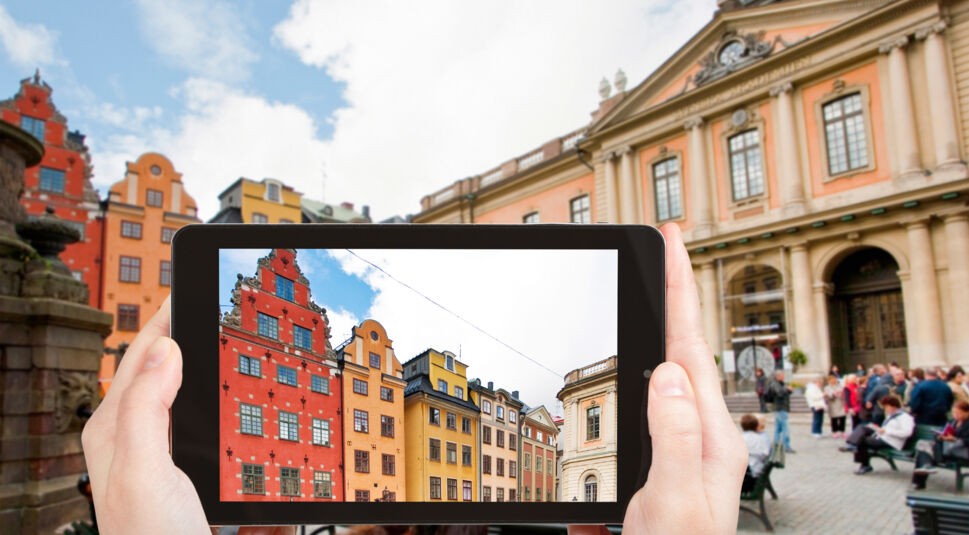 tourist taking photo Stortorget square Stockholm