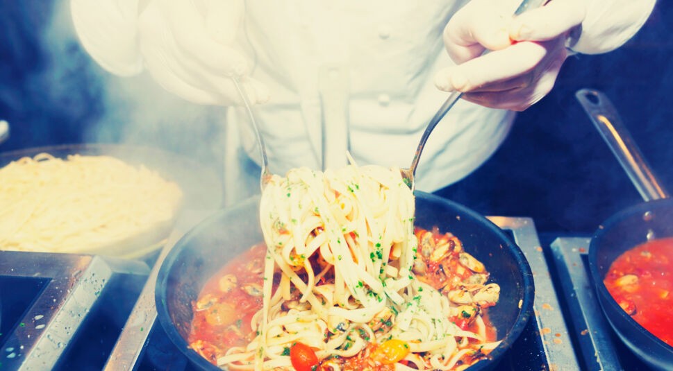 Chef is frying mussels, toned