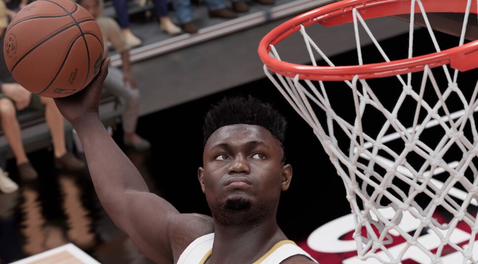 Basketballspieler dunkt den Ball in den Korb