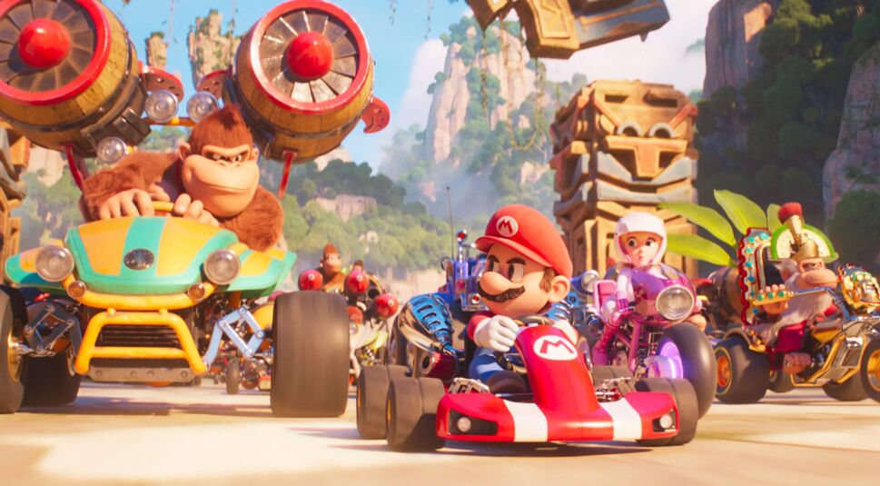 Mario, Donkey Kong und weitere Figuren sitzen in Karts